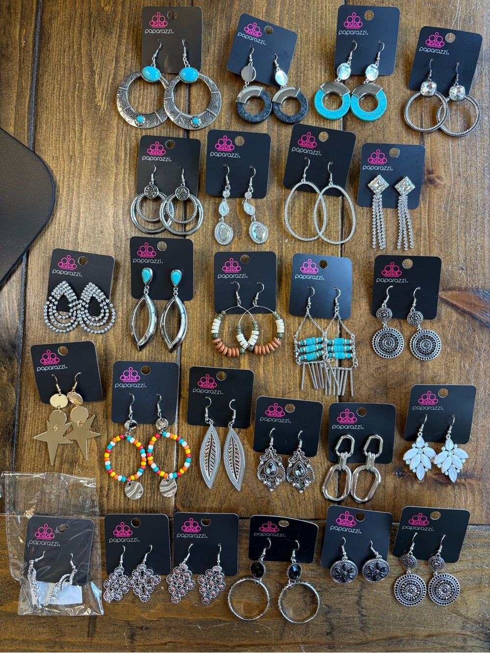 25 Pairs of Paparazzi Earrings.